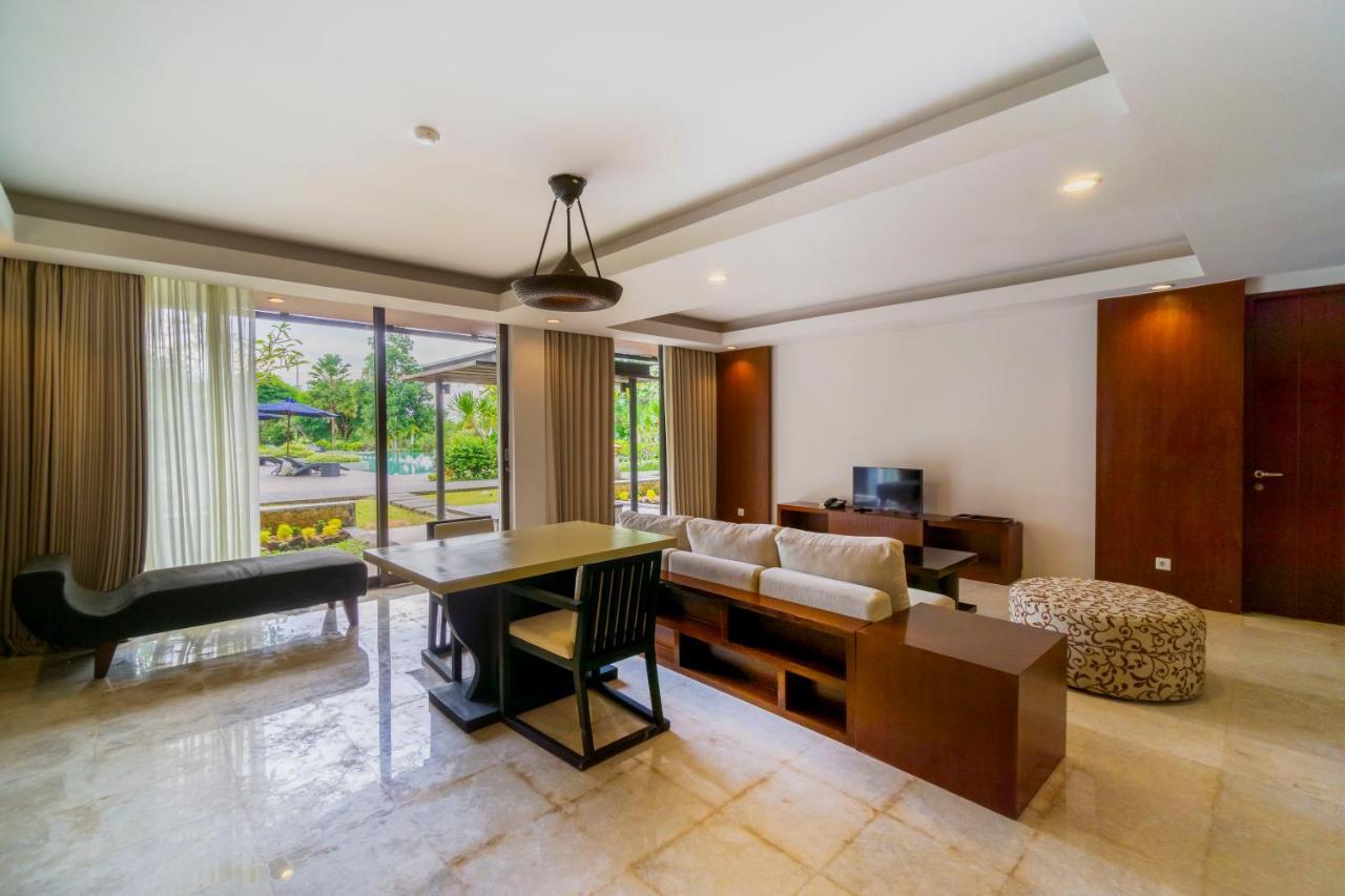 Le Grande Bali Hotel Uluwatu  Exterior photo Living room of a suite at the hotel